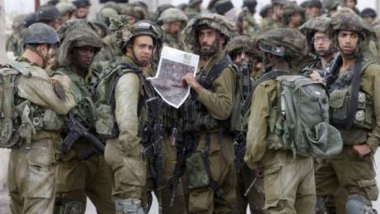 IDF soldiers take part in an operation to locate three Israeli teens near Hebron June 21, 2014.