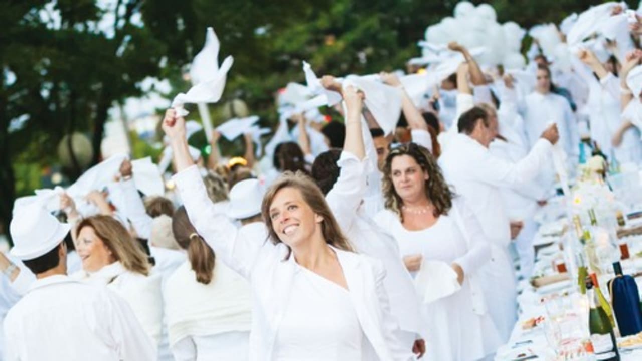 Participants in Quebec’s ‘Dinner in White,’ a worldwide spontaneous formal dinner in an undisclosed urban location.
