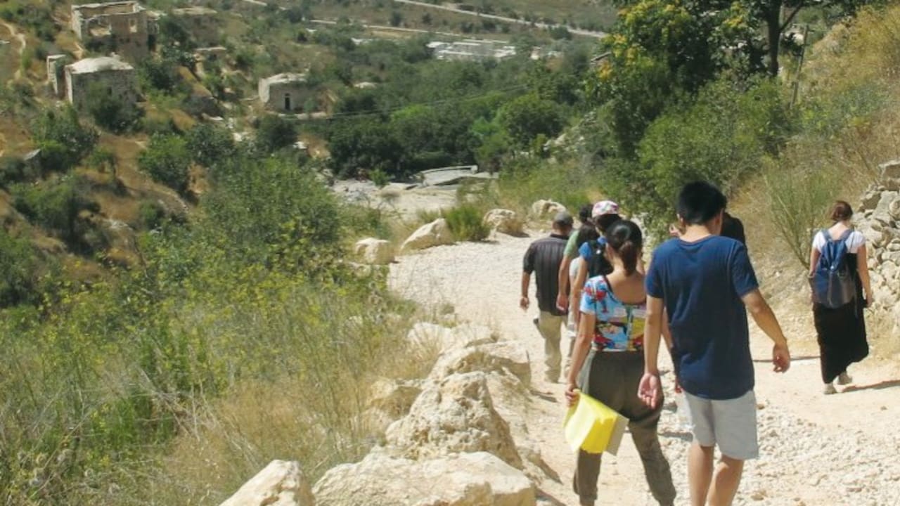 STUDENTS FROM the Hebrew University’s Rothberg International School tour Lifta on the outskirts of Jerusalem.