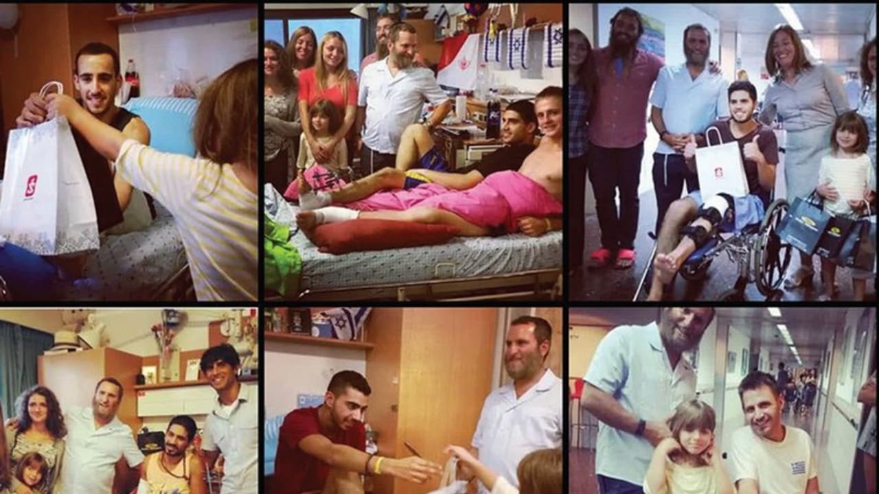 THE BOTEACH family visiting wounded soldiers at Sheba Medical Center