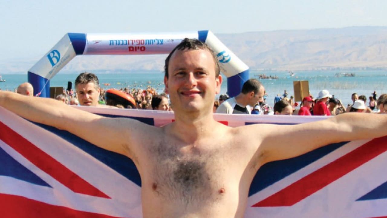 BRITISH AMBASSADOR Matthew Gould swims proudly for the flag in the Sea of Galilee.
