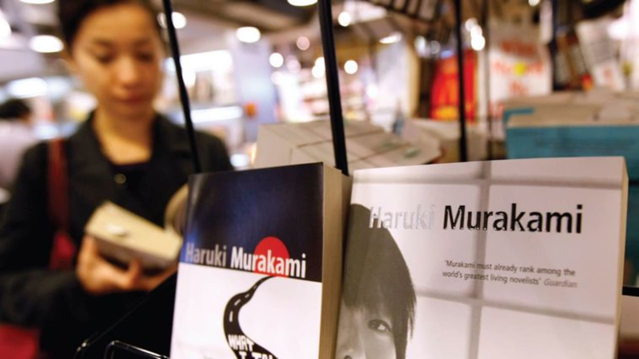Haruki Murakami books on sale in English at a Japanese bookstore.