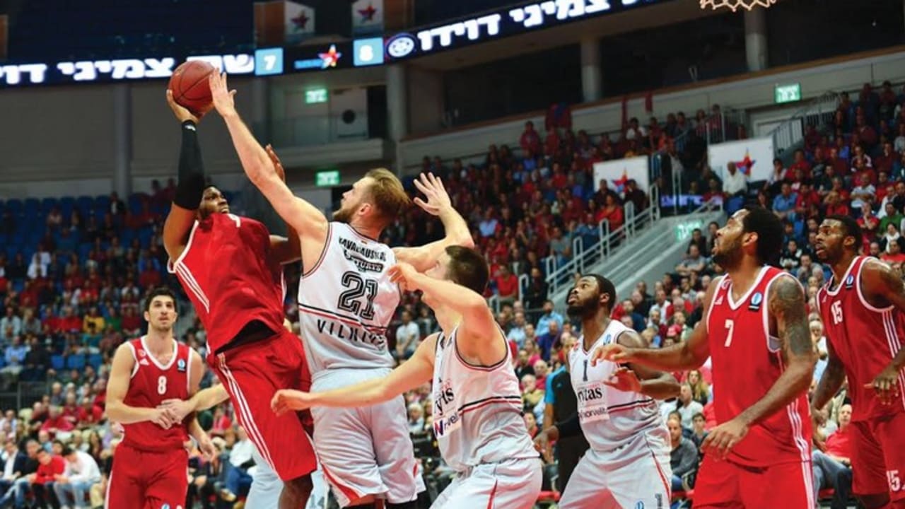 Hapoel Jerusalem's Joseph Jones (with the ball) and Derwin Kitchen