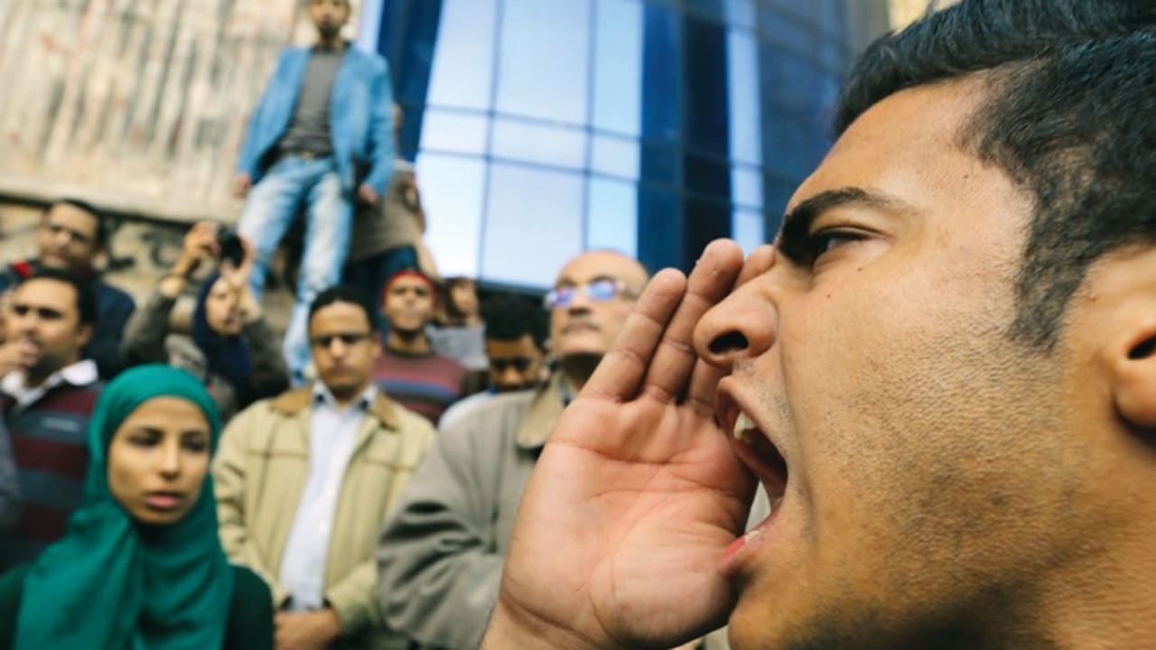 A man shouts anti-government slogans during a protest against the court dropping its case against Egypt’s former president Hosni Mubarak, in Cairo.