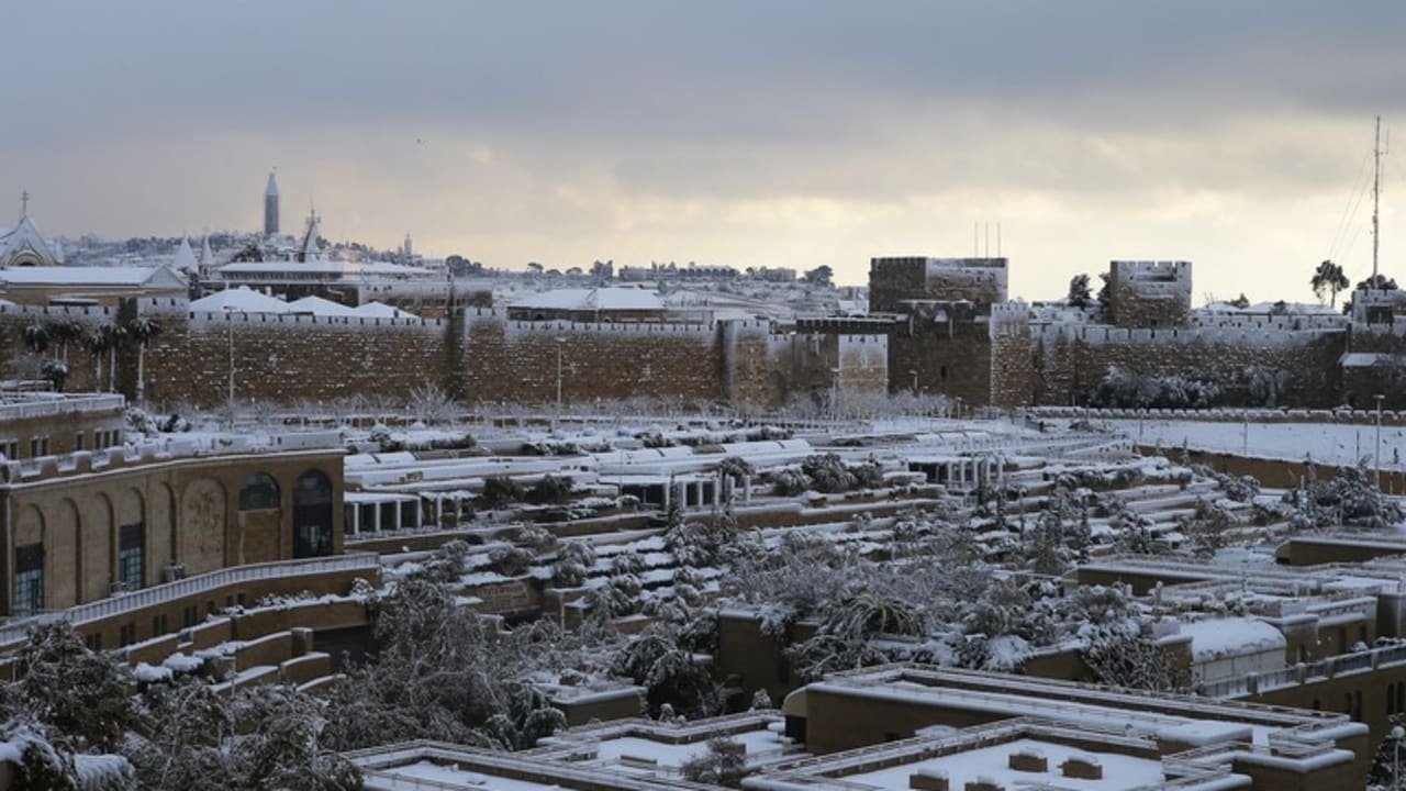 Snow covers the city during a snow storm in Jerusalem December 13, 2013