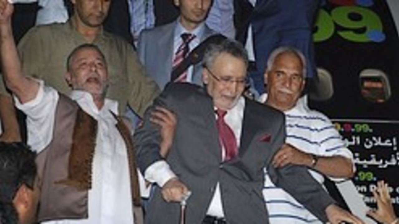 Megrahi lockerbie bomber leaving plane
