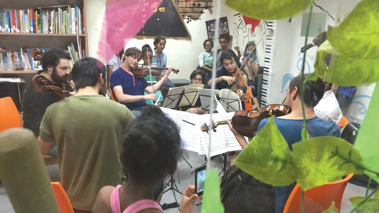 MUSETHICA MUSICIANS play in front of a group of children in Israel.