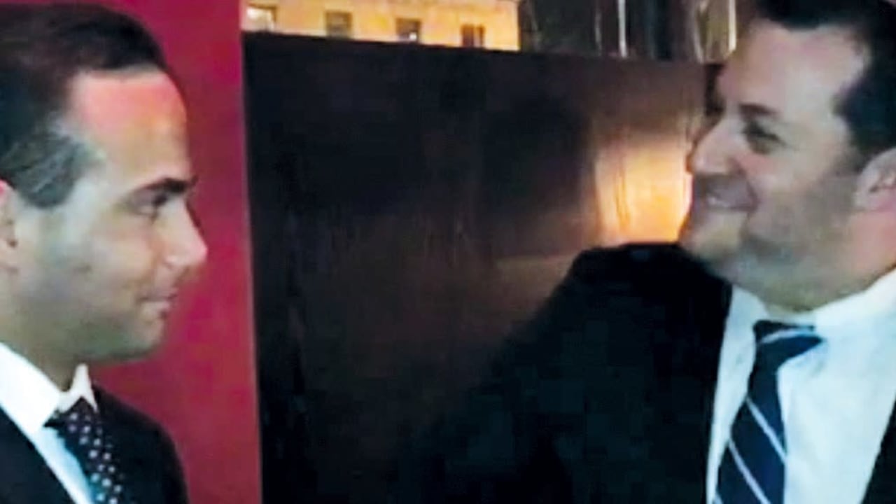 George Papadopoulos shakes hands with Yossi Dagan