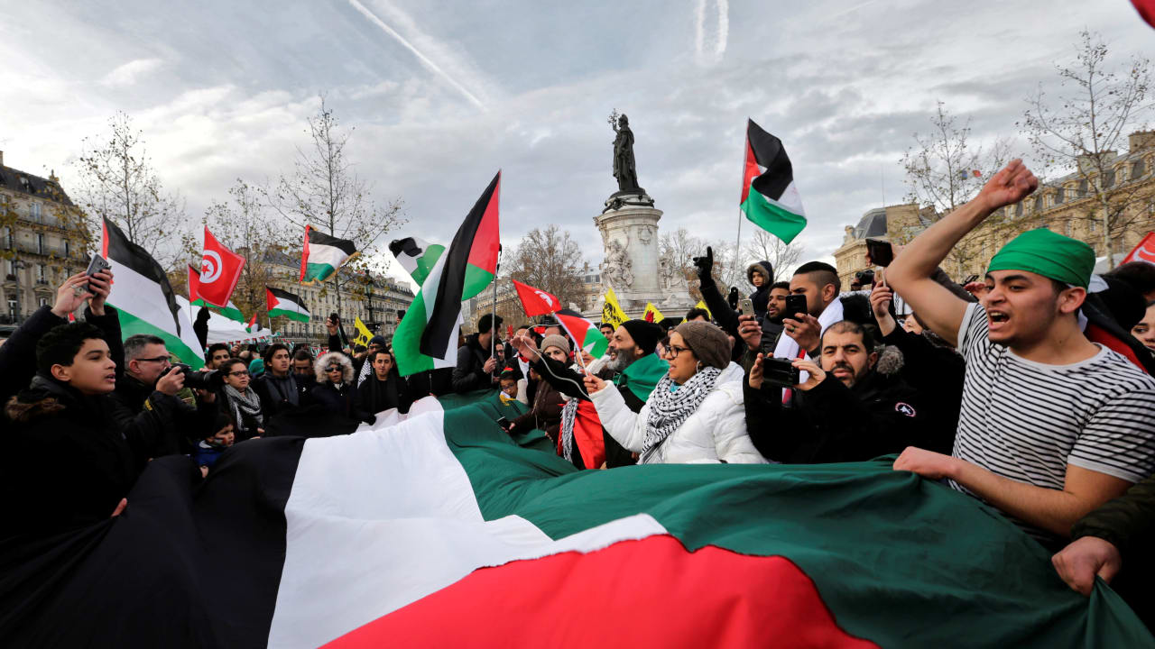 Activists protest against the visit of Israel's Prime Minister Benjamin Netanyahu in Paris, France, December 9, 2017. 