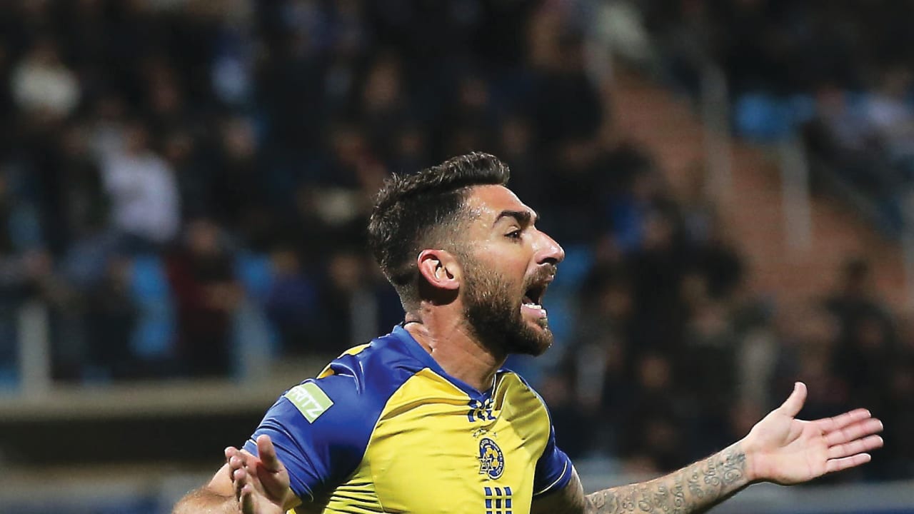 MACCABI TEL AVIV striker Eliran Atar celebrates after scoring his team’s opener in last night’s 2-0 victory at Hapoel Acre in Premier League action
