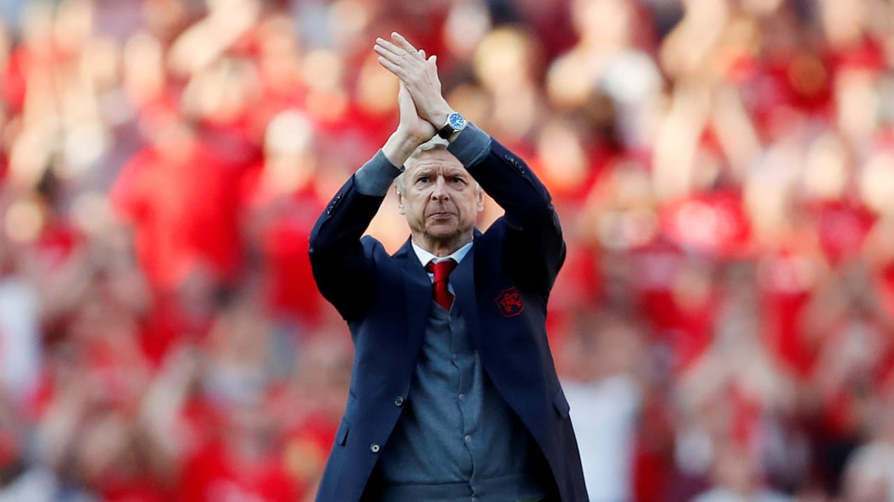 Arsenal manager Arsene Wenger applauds the fans after the match.