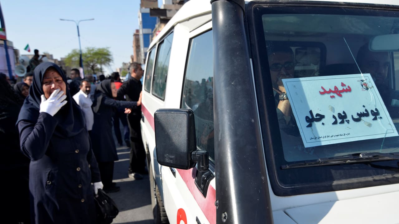 Ambulance is seen during a funeral of the victims of assault that killed 25 people, in the streets of the southwestern Iranian city of Ahvaz