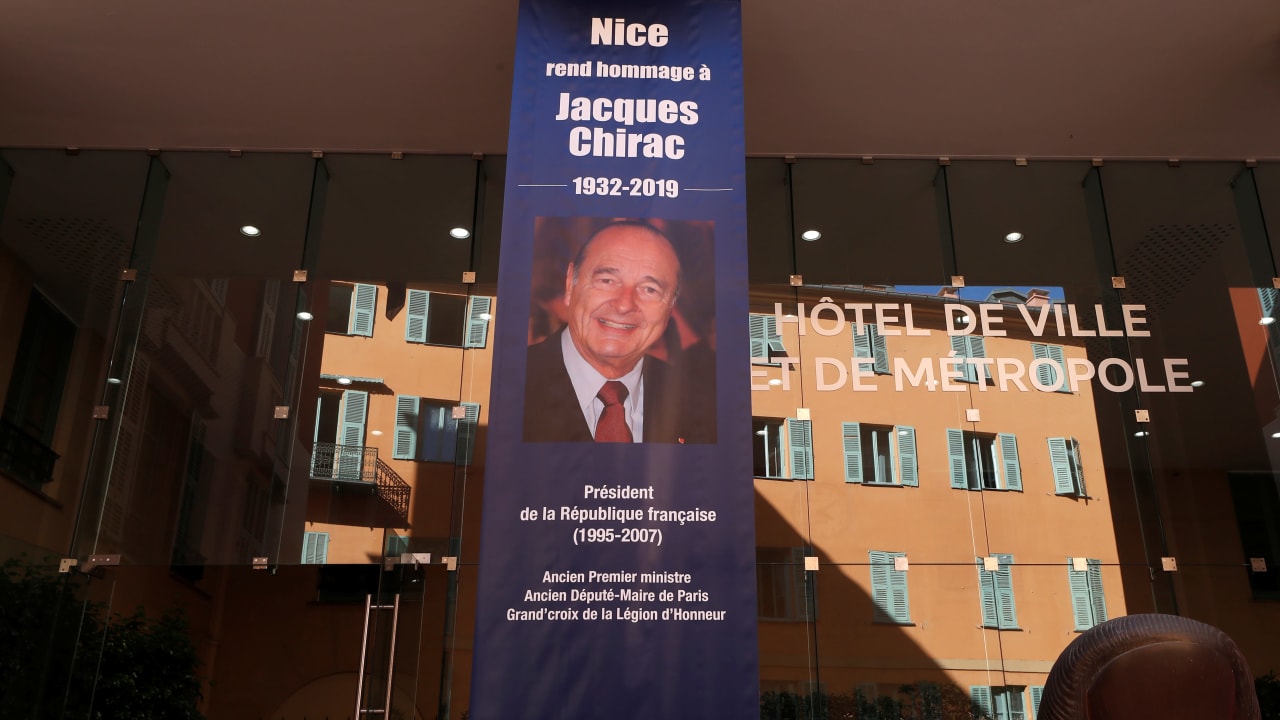 A banner to pay tribute to former French President Jacques Chirac is seen in front of the city hall in Nice