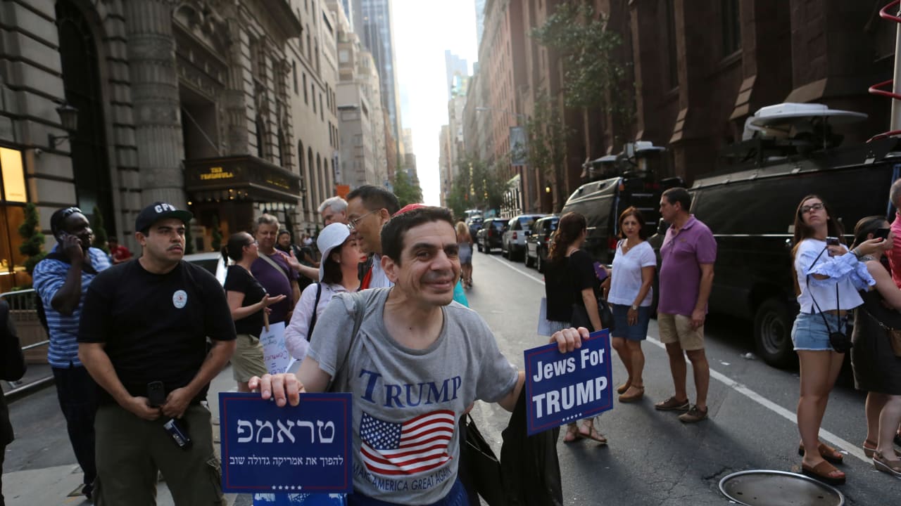 A Trump supporter in a protest march against white nationlism   