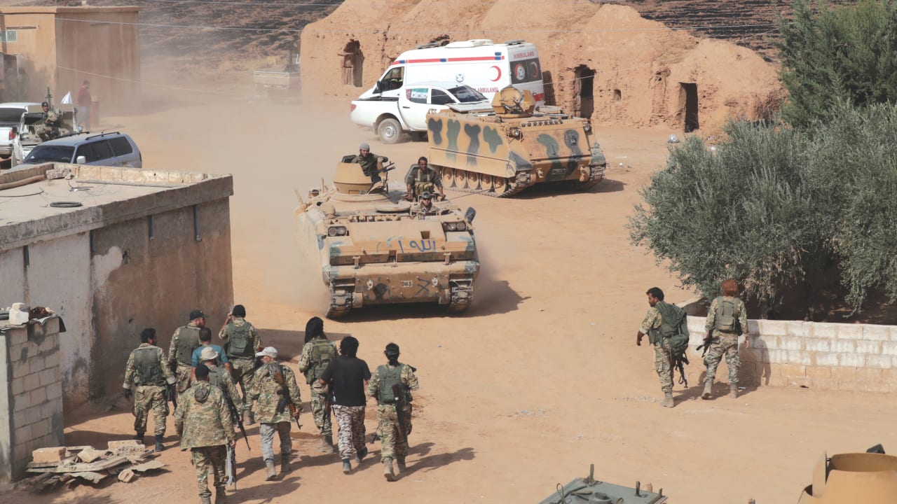 TURKISH-BACKED Jihadists drive a tank near Tel Abyad in Syria.