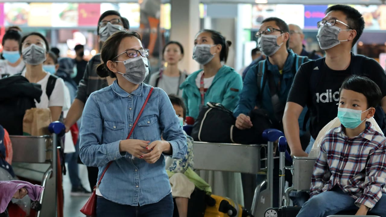 Passengers wearing masks are seen at Kuala Lumpur International Airport 2 in Sepang, Malaysia, January 27, 2020
