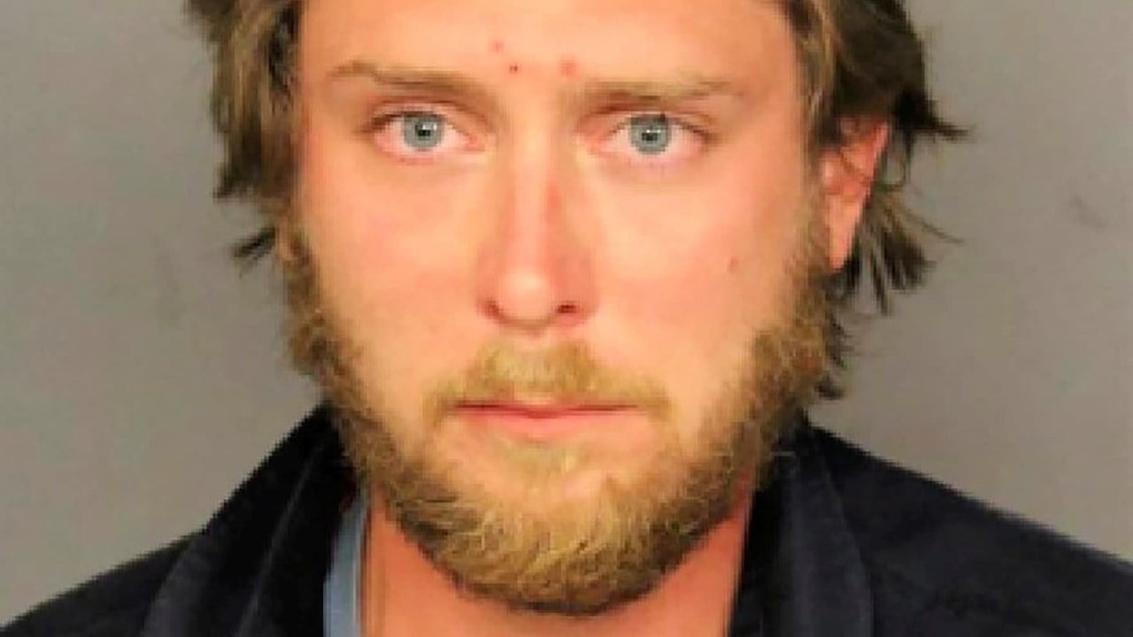 Matthew Dolloff is seen in a Denver Police Department's mugshot. Dolloff, 30, has been jailed on suspicion of first-degree murder in the fatal shooting of a protester, police said on October 11, 2020. Denver Police Department/Handout via FILE PHOTO: Matthew Dolloff is seen in a Denver Police Departm