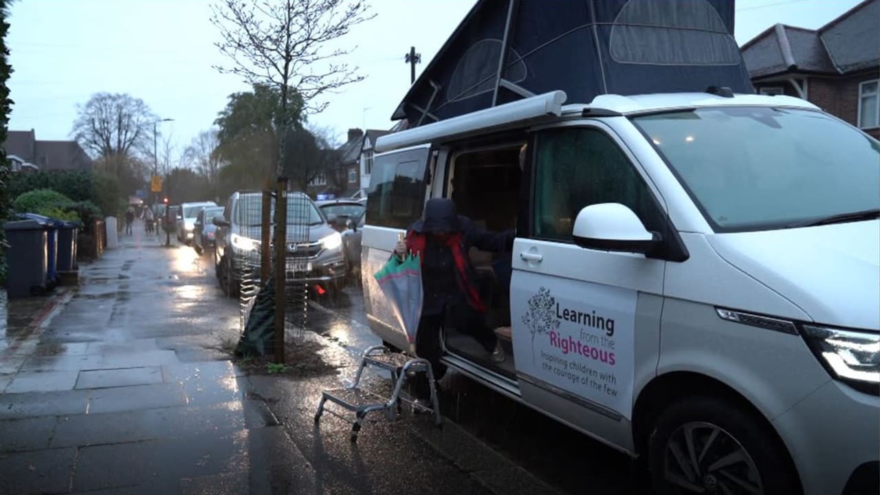 Holocaust survivor Mala Tribich exits the Learning from the Righteous mobile studio in London. (Learning from the Righteous)