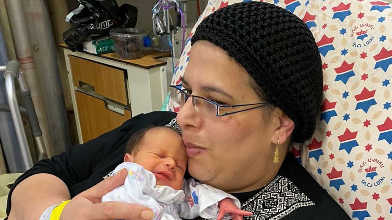 Noa Oz, with her baby, after being sedated and ventilated for seven weeks due to coronavirus complications, January 29, 2021. 