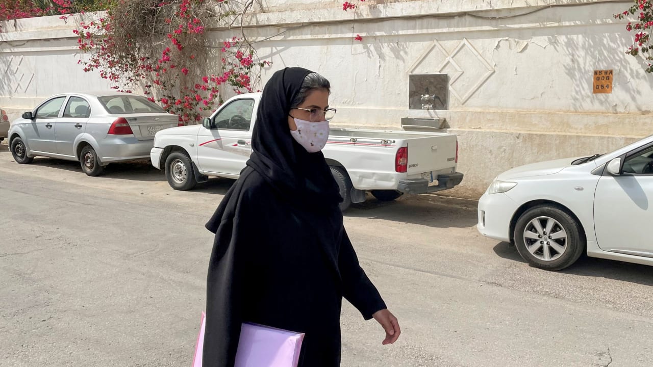 Saudi activist Loujain Al-Hathloul makes her way to appear at a special criminal court for an appeals hearing in Riyadh