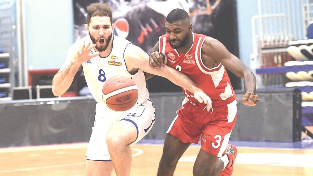 HAPOEL BEERSHEBA and Bnei Herzliya engaged in a fierce Winner League battle on Monday night, with Amir Bell (right) and Beersheba prevailing 77-75. 