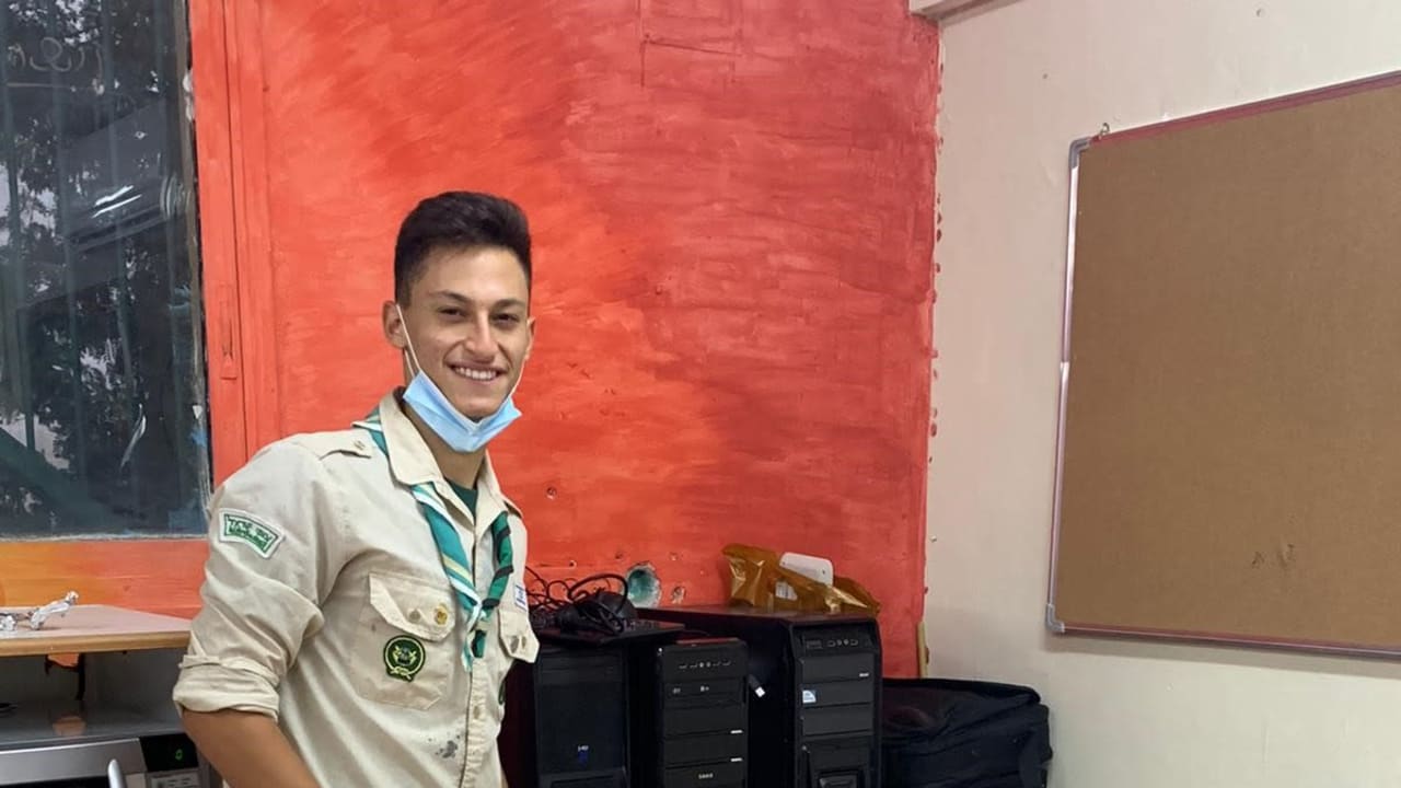 A Scout displays computers collecting for Mitchashvim