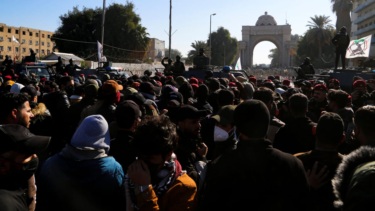 Supporters of Iraqi Shiite parties disputing the vote results gather before Iraq's Supreme Court issues a verdict ratifying election results, in Baghdad, Iraq, December 27, 2021.
