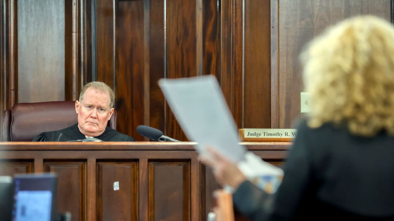  Superior Court Judge Timothy Walmsley, left, listens to Greg McMichael's attorney Laura Hogue, right, during the sentencing of Greg McMichael and his son, Travis McMichael, and a neighbor, William "Roddie" Bryan at the Glynn County Courthouse, Brunswick, Ga. U.S., Friday, January 7, 2022.