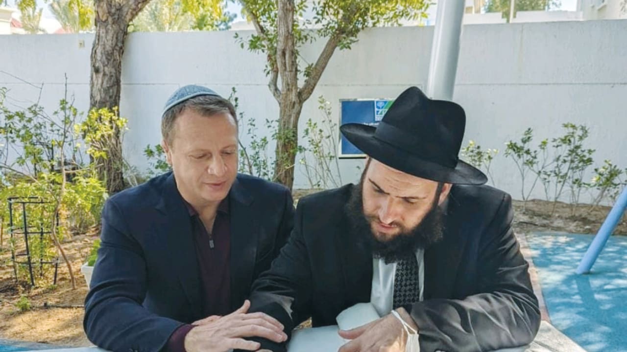  TOURISM MINISTER Yoel Razvozov with Rabbi Levi Duchman during the writing of an additional letter in the yet to be completed UAE Torah scroll.