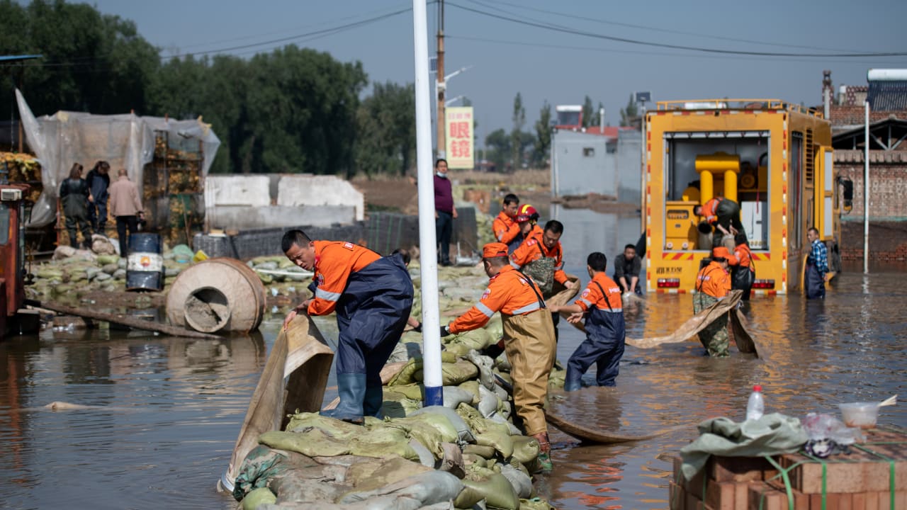  Rescue workers use a pump to drain off floodwater following heavy rainfall at a village in Jiexiu city, Shanxi province, China October 11, 2021.