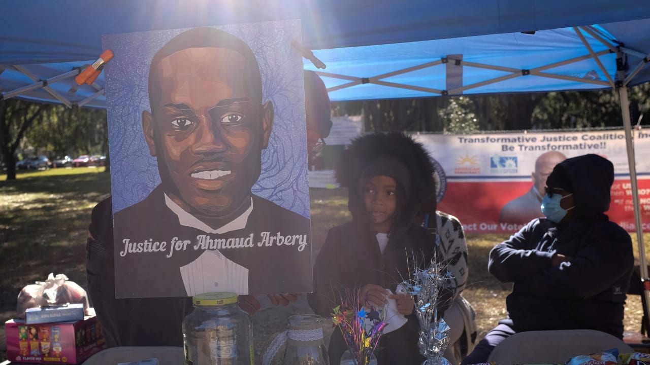  A poster depicting Ahmaud Arbery is seen outside the Glynn County Courthouse while Greg McMichael, his son Travis McMichael and William "Roddie" Bryan are tried over the killing of Ahmaud Arbery, in Brunswick, Georgia, US, November 23, 2021. 