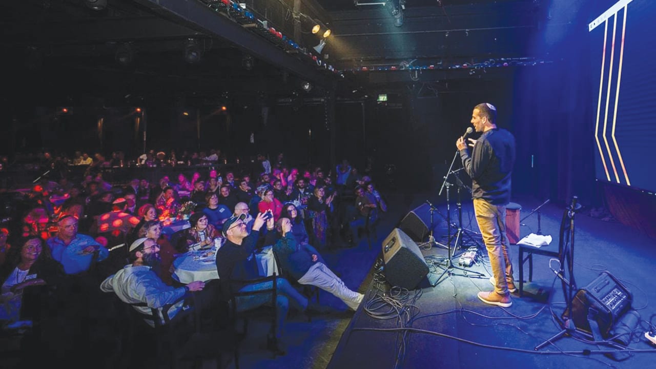  THE WRITER addresses a Nifgashim gathering in Tel Aviv. 