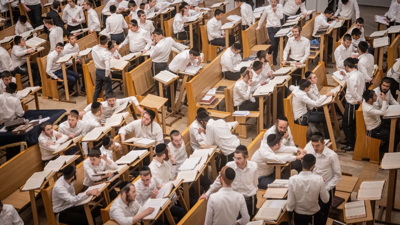  Jewish yeshiva students study at the Kamenitz Yeshiva, in Jerusalem on September 9, 2024.