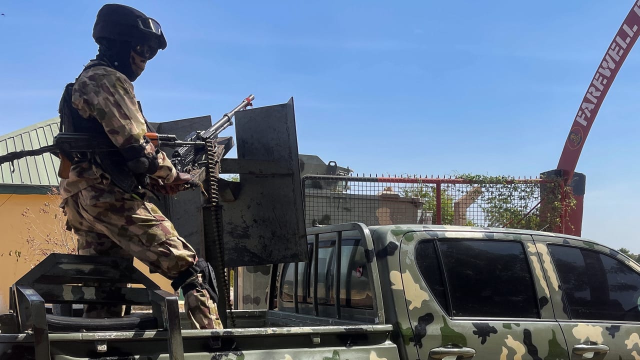 A Nigerian soldier stands on a military truck, during the tour of the Theatre Command Operation Lafiya Dole by Nigeria's Chief of Army Staff, at the Maimalari Cantonment in Maiduguri, Borno, Nigeria, November 7, 2025