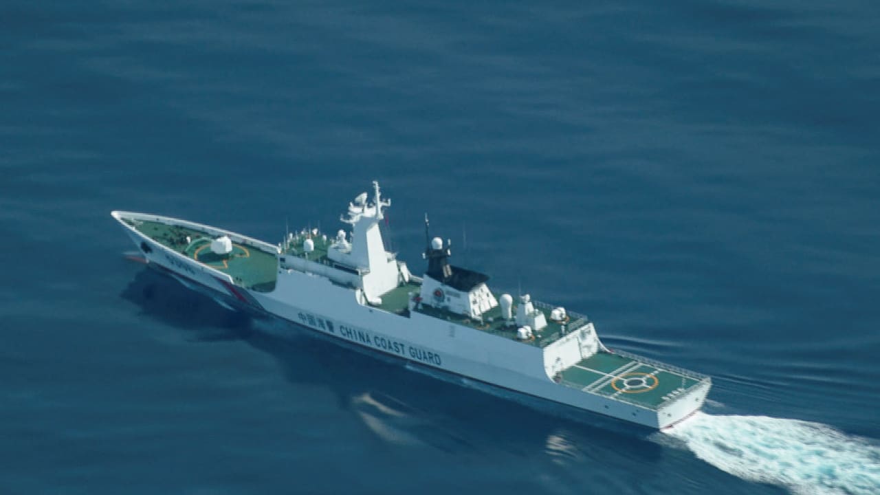 A China Coast Guard ship navigating near the disputed Scarborough Shoal, as Philippine Coast Guard aircraft carrying journalists patrols the area, days after two Chinese vessels collided in the area while allegedly trying to block a Philippine supply mission, in the South China Sea, August 13, 2025.