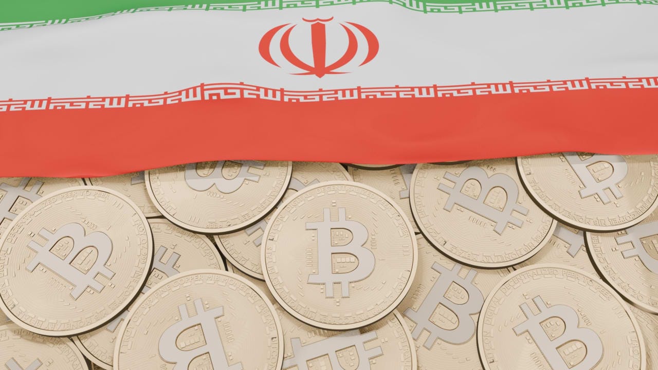 Bitcoins are seen on the background of the Iranian flag (illustrative)