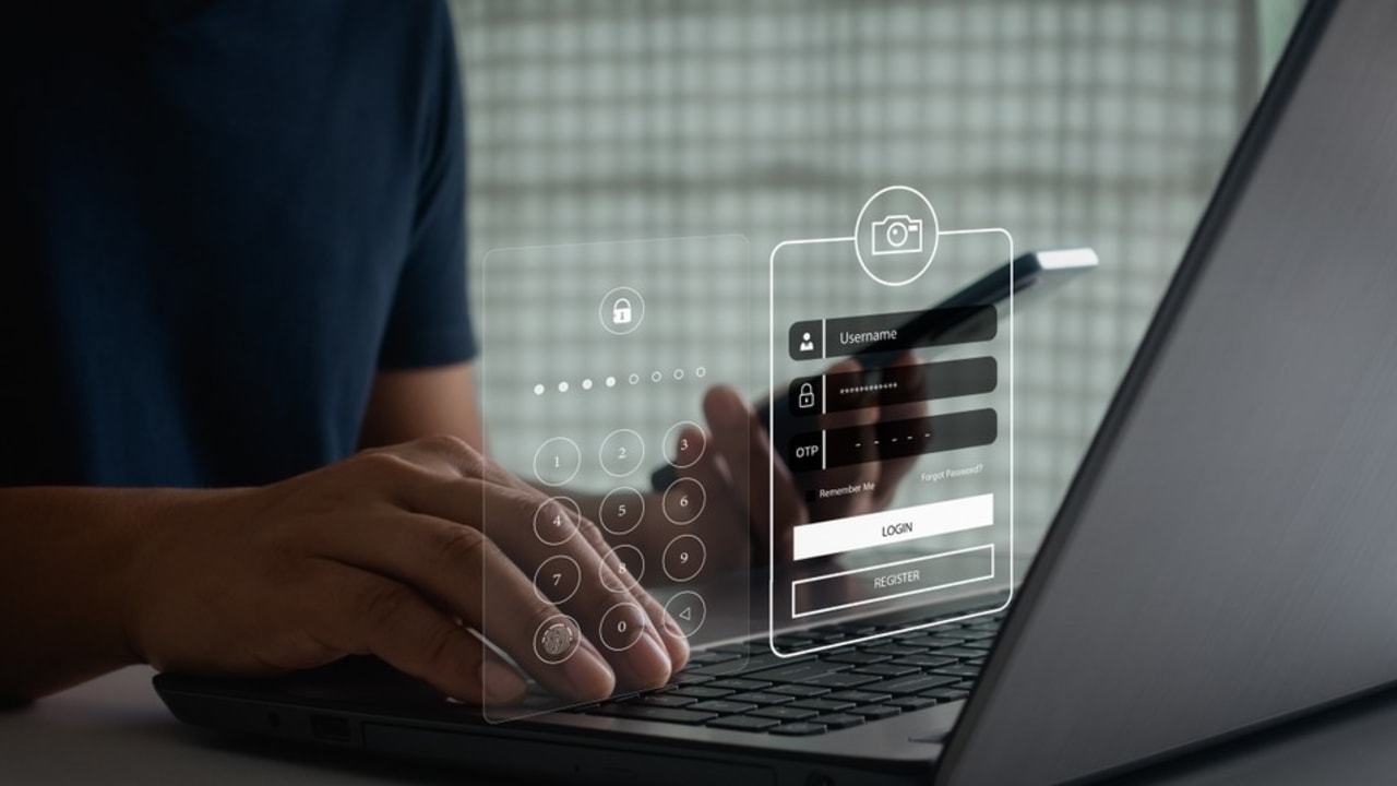 Customer support agent with headset verifying code.