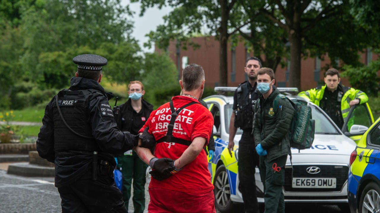 File photo: A protestor is arrested as activists from Palestine Action protest at the HQ of Elbit, an Israeli owned company that makes drones for use by the Israeli military and other foreign powers on May 15, 2022 in Bristol, England. 