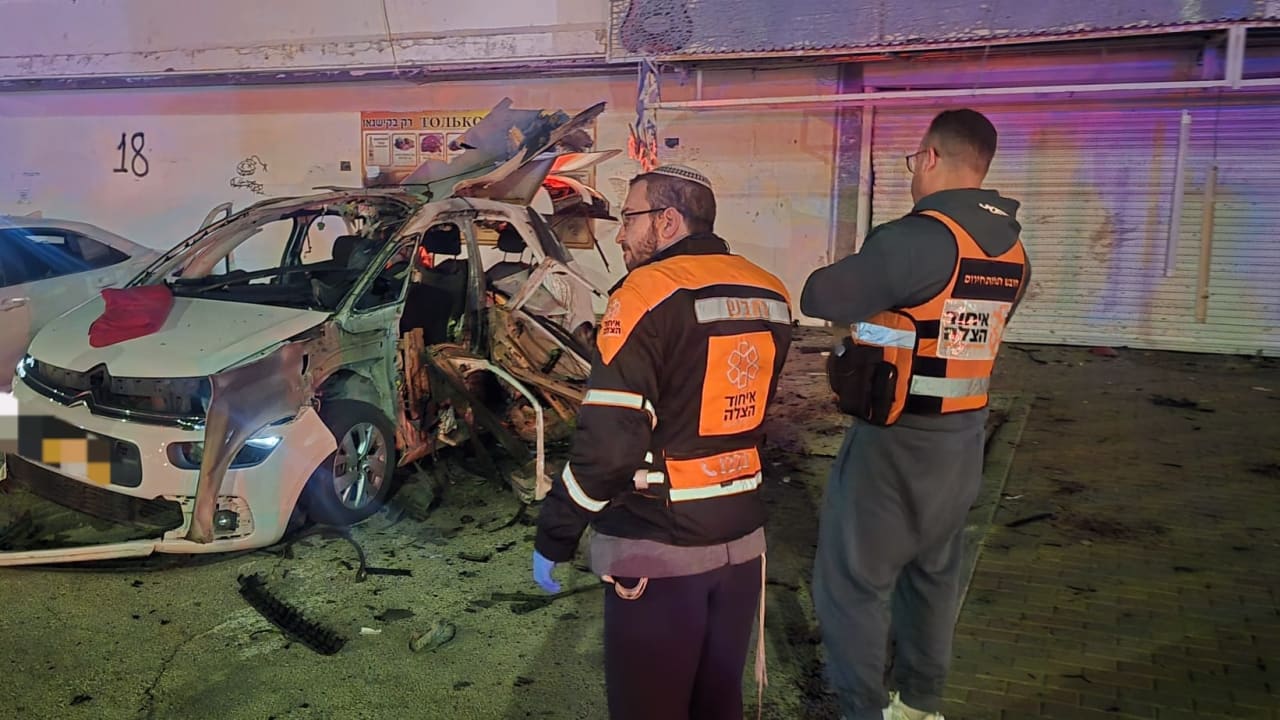 United Hatzalah emergency responders look on in the aftermath of a vehicle explosion in Kiryat Yam, near Haifa, February 4, 2026.