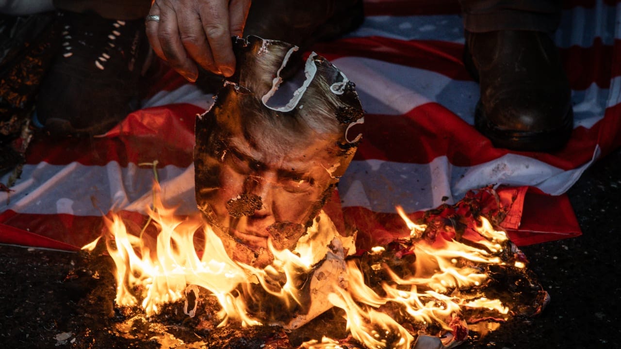 IRANIAN PRO-GOVERNMENT supporters burn pictures of US President Donald Trump, last month. If Trump’s bluster against Iran just leads to another soft deal that kicks the Iranian nuclear can down the road, then Trump’s presidency is finished, the writer says. 