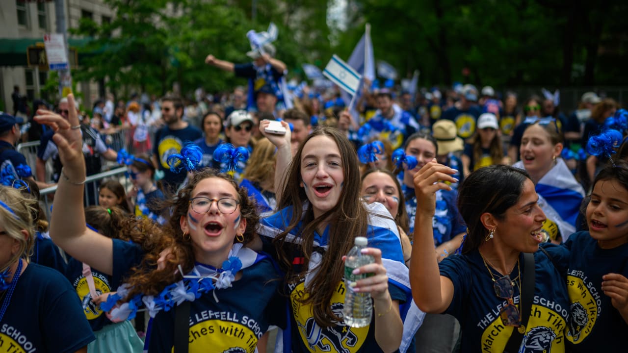 Participants cheer and dance during the Celebrate Israel Parade up Fifth Avenue on May 18, 2025 in New York City.