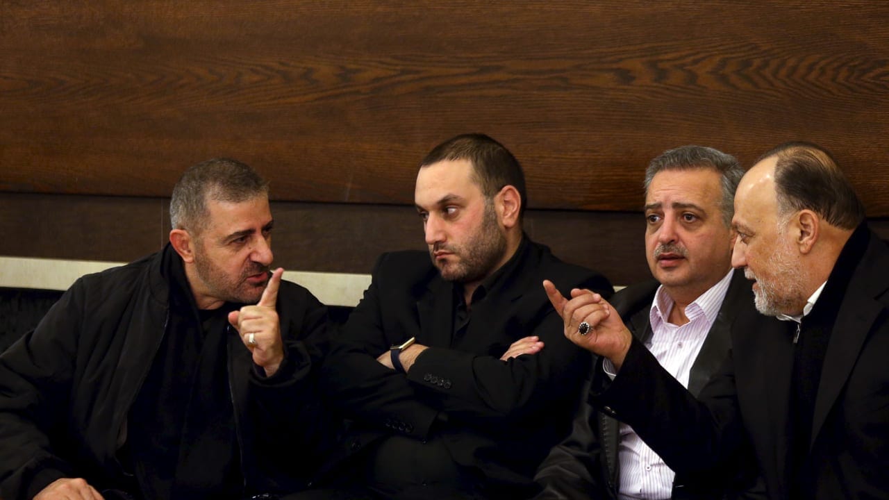 Hezbollah official Wafiq Safa (L) talks Hezbollah parliament member Ali Ammar (R), Lebanon December 20, 2015. 
