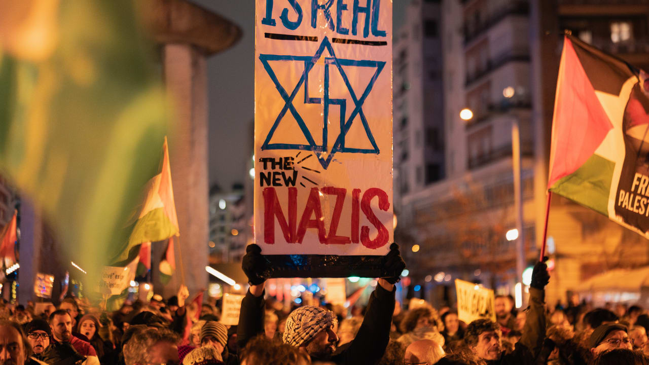 Pro-Palestinian protesters demonstrate outside Movistar Arena as Real Madrid face Maccabi Tel Aviv in a EuroLeague basketball game on January 8, 2026, in Madrid, Spain. 