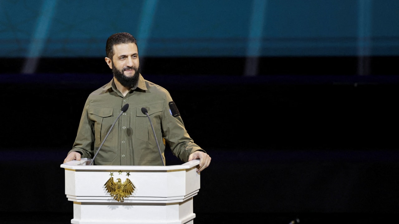 Syria's President Ahmed al-Sharaa delivers a speech on the first anniversary of Bashar al-Assad's fall, in Damascus, Syria December 8, 2025.