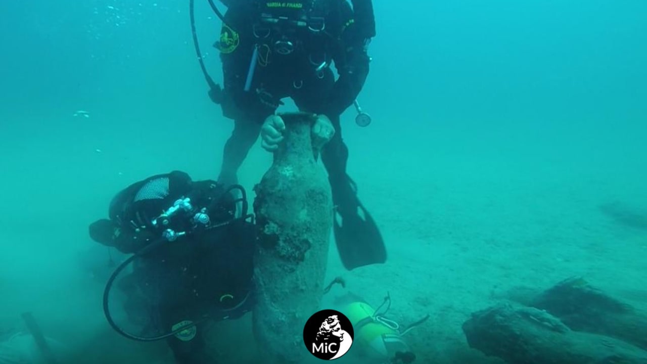 Divers carrying amphorae from the fourth century AD Roman shipwreck discovered off the coast of Gallipoli, southern Italy in June 2025.