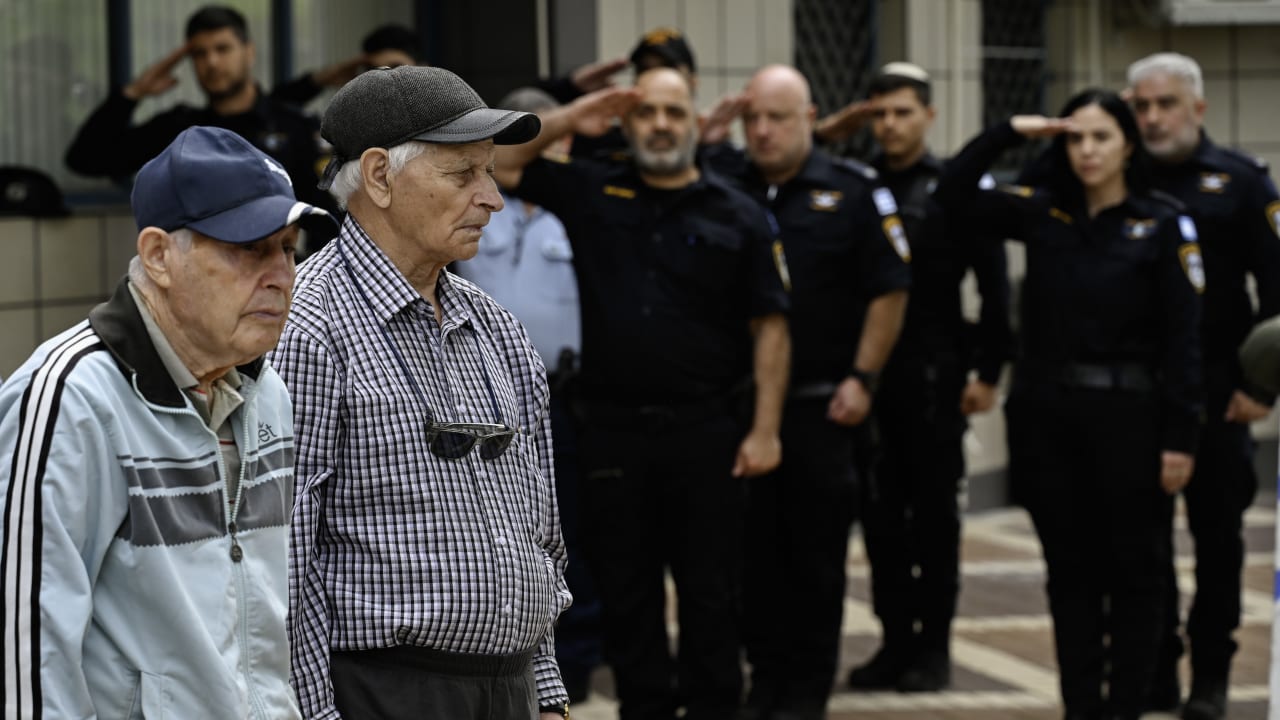 Holocaust survivors and WW2 veterans from the former Soviet Union take part at the Holocaust Memorial service of their local Police station, Katsrin, Golan Heights, April 24, 2025.