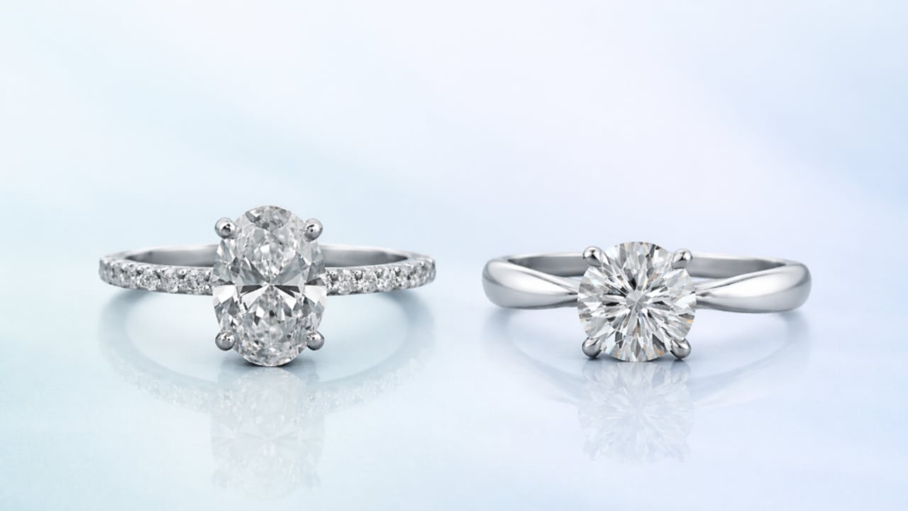Oval and round solitaire diamond engagement rings reflecting shifts in the jewelry market during global conflict.