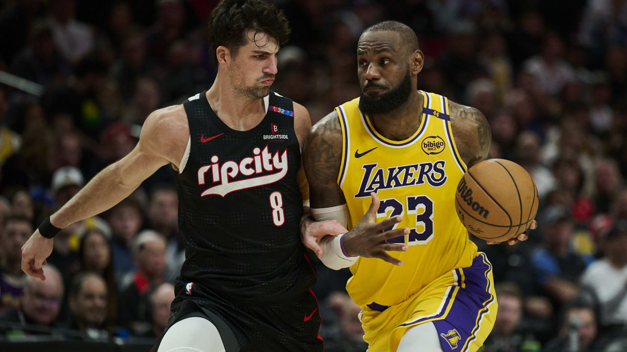 Portland, Oregon, USA; Los Angeles Lakers forward LeBron James (23) drives to the basket during the second half against Portland Trail Blazers forward Deni Avdija (8) at Moda Center, Feb 20, 2025.