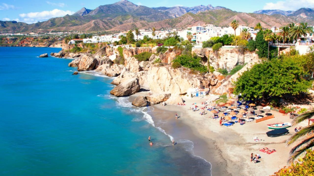 Tourism on the beach in the city of Nerja, Málaga.