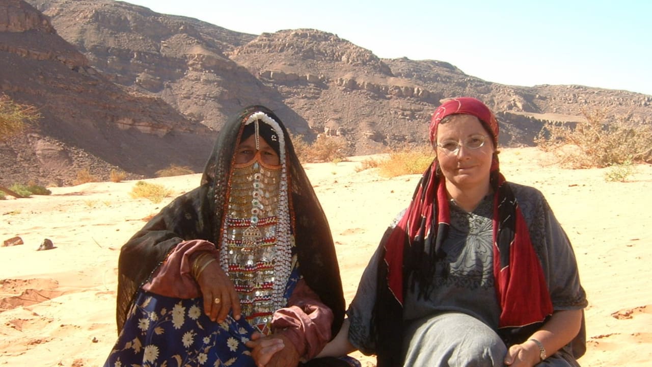 Margaret Malka Rawicz sits with a Bedouin lady who took her to tend sheep in Sinai Desert. 
